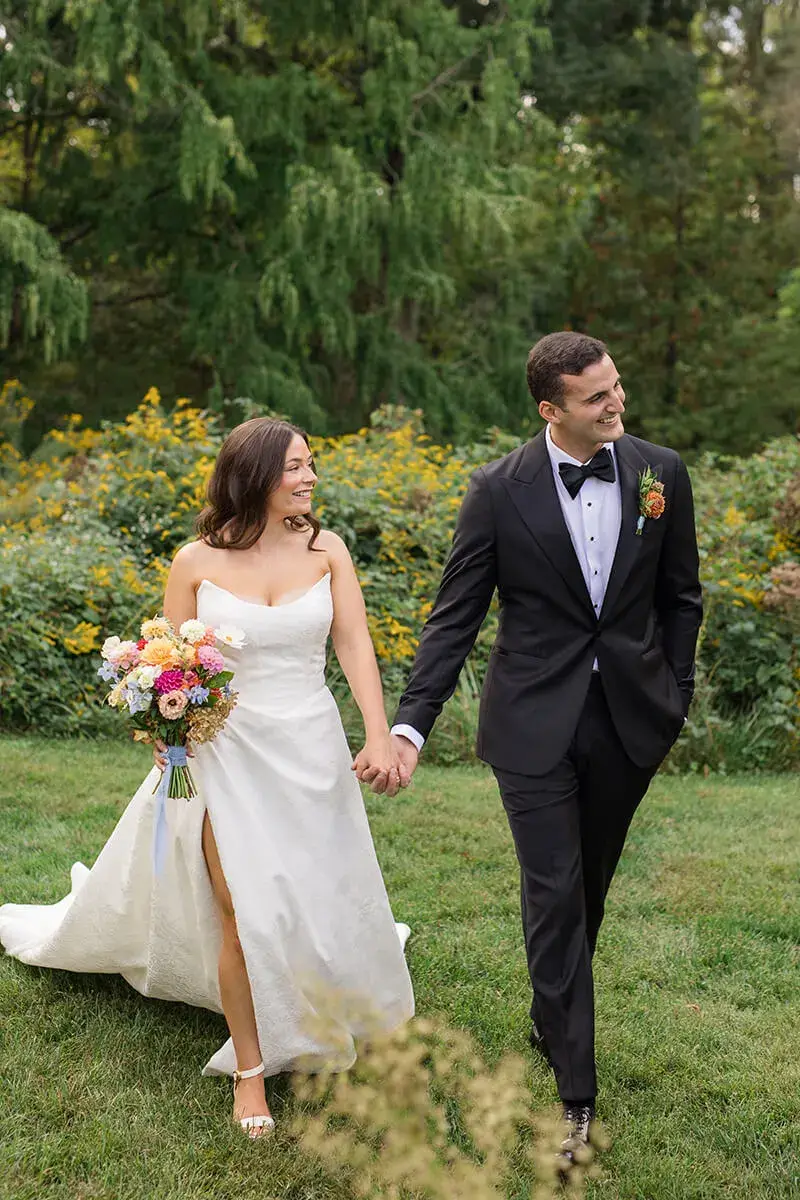 wedding couple holding hands outdoors